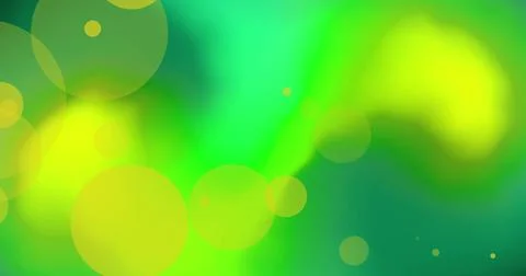 Image of orange glowing spots over vibrant abstract green and yellow background Fotos Stock