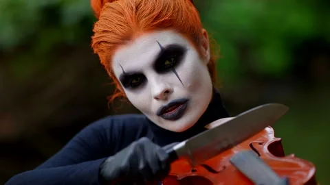 The image with orange hair and dramatic makeup in black tones  스톡 동영상 297608841