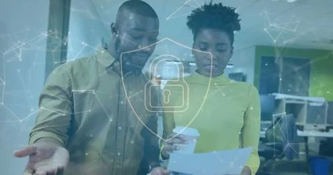 Image of padlock and data processing over diverse business people in office Stock Photos