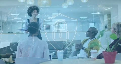 Image of padlock and data processing over diverse business people in office 写真素材