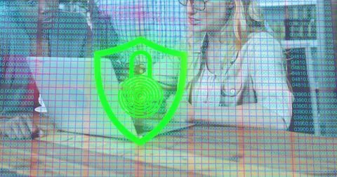 Image of padlock icon and data processing over caucasian woman using laptop Stock Photos