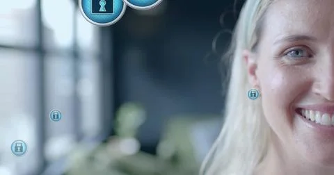 Image of padlock icons data processing over caucasian businesswoman in office 写真素材