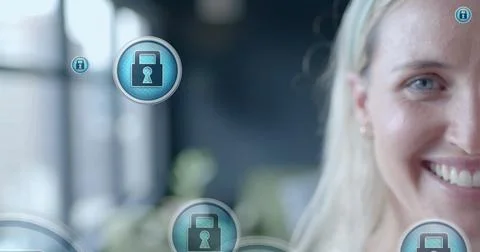 Image of padlock icons data processing over caucasian businesswoman in office Stock Photos