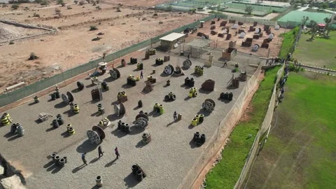 Image of a paintball field with obstacles and bunkers viewed from the air Stock-Footage 247186402