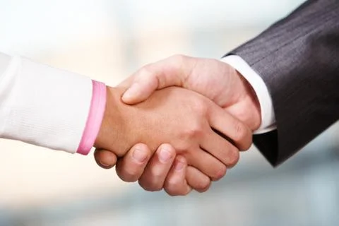 Image of partners handshake after signing contract Stock Photos
