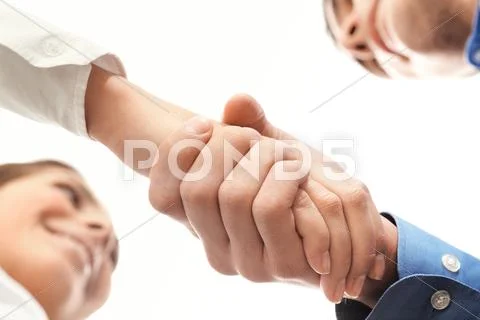 Image of partners handshake after signing contract Stock Photos