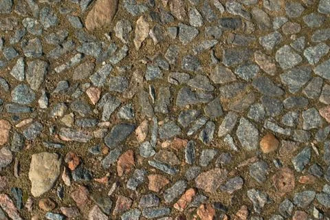 Image of a path paved with small stone as background 스톡 사진
