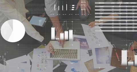 Image of people using a laptop computer in a busy office with white data Stock Photos