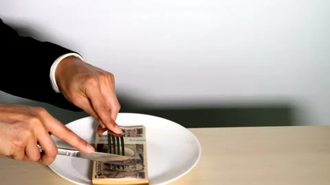 The image of a person who eats money Stock Footage 334811526