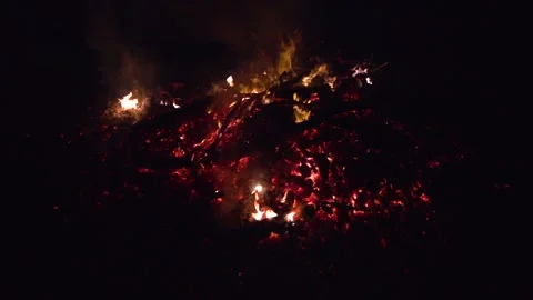 Image of a pile of trash burning in slow motion during the night. Stock Footage 151602737