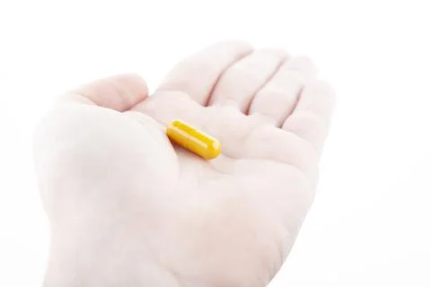 Image of pill hand white background Stock Photos