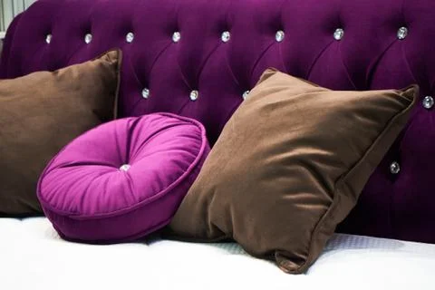 The image of the pillow lying on the bed. Stock Photos