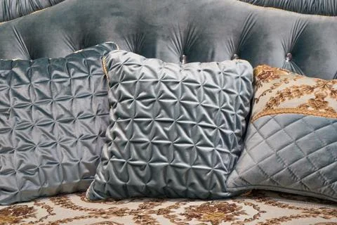 The image of the pillow lying on the bed. Stock Photos