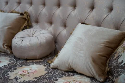 The image of the pillow lying on the bed. Stock Photos