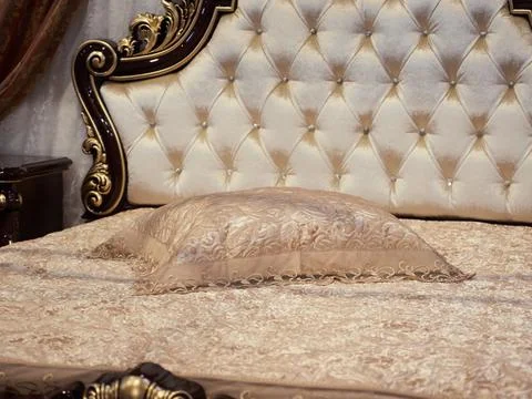 The image of the pillow lying on the bed. Stock Photos