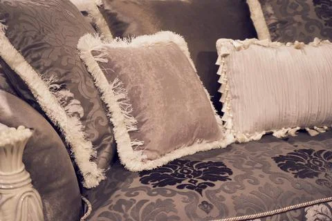The image of the pillow lying on the bed. Stock Photos