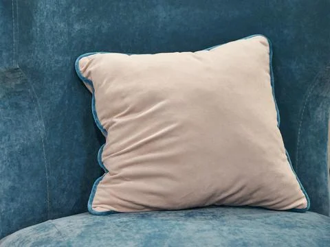 The image of the pillow lying on the bed. Stock Photos