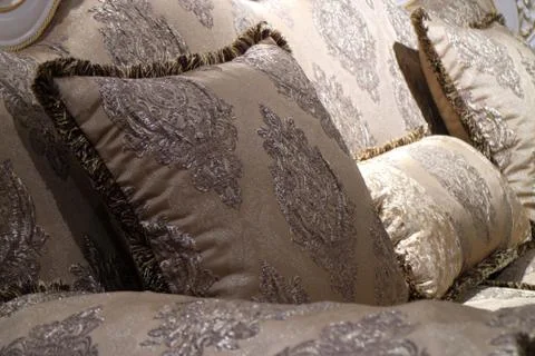 An image of a pillow lying on the couch. Stock Photos
