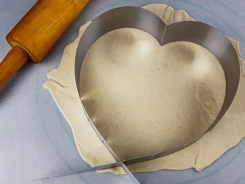 The image of a pizza in the form of a heart. preparing for a Valentine's Day  Stock Photos