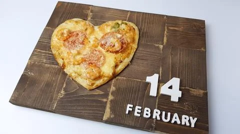 The image of a pizza in the form of a heart. preparing for a Valentine's Day  Stock Photos