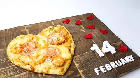 The image of a pizza in the form of a heart. preparing for a Valentine's Day  Stock Photos
