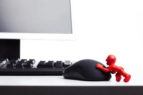 Image of plasticine man pushing computer mouse Stock Photos