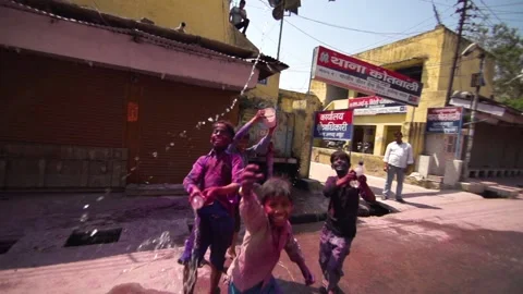 Image of poor kids playing at the street of Delhi during Holi festival, India Stock Footage 151865053