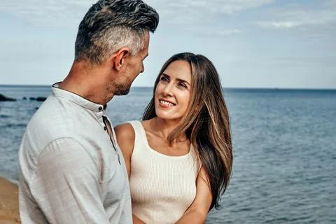 Image of a positive smiling optimistic beautiful adult loving couple walking  Stock Photos