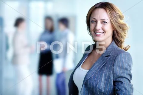 Image of pretty business leader looking at camera Stock Photos