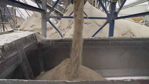 In this image, processed materials are being poured into a large container Stock Footage 314795871