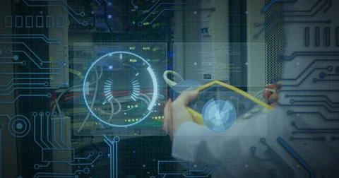 Image of processing circle over data and hands of caucasian man checking Foto stock