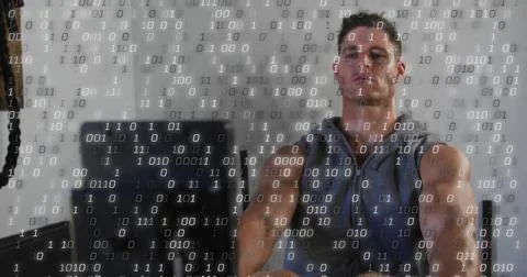 Image of processing data over caucasian man using rowing machine at gym Stock Photos