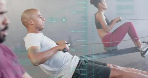 Image of processing data over diverse group training on rowing machines at gym 스톡 사진