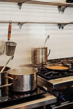 Image of a professional kitchen preparing a paella Stock Photos