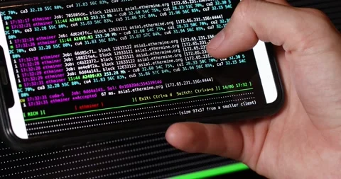 Image of the program code showing the process of mining cryptocurrency by phone Stock Footage 156040320