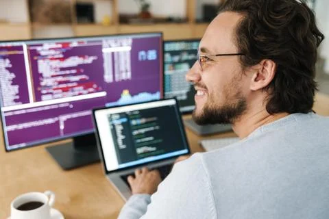 Image of programmer man wearing eyeglasses working with computers Stock Photos