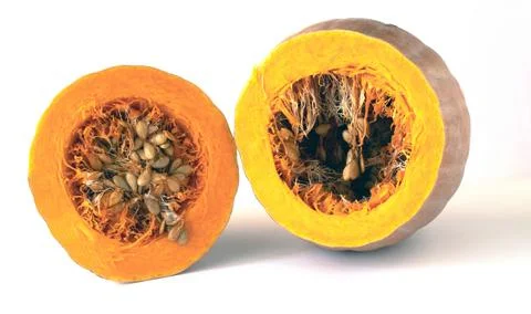 Image of a pumpkin cut in half filled with ripe seeds.White background. Foto stock
