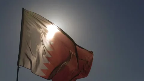 Image of Qatar flag waving at the wind in the desert near Doha. Stock Footage 149001708