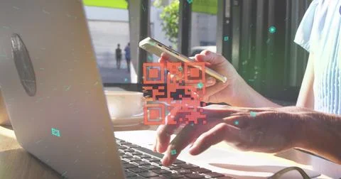 Image of qr code and shapes over caucasian woman using laptop and smartphone 库存照片
