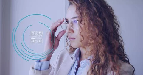 Image of qr code over biracial businesswoman in office Stock Photos