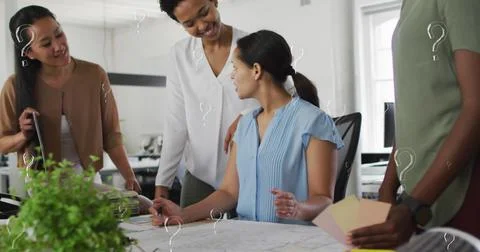 Image of question mark symbols over multiracial coworkers discussing in meeting Stock Photos