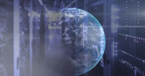 Image of rainbow lens flare and globe against computer server room Stock Photos