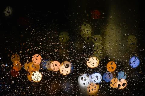 Image of raindrops whith bokeh on window Stock Photos