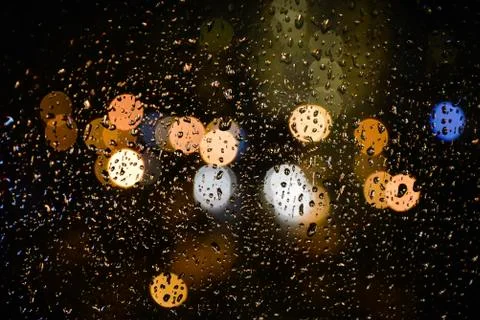 Image of raindrops whith bokeh on window Stock Photos