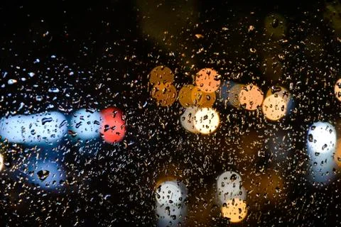 Image of raindrops whith bokeh on window Stock Photos