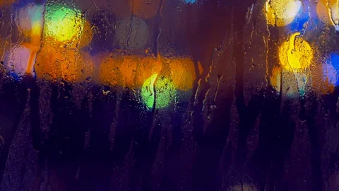 Image of raindrops on window at night in the city Stock Footage 99125839