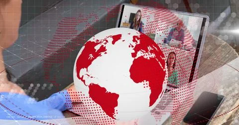 Image of red and white globe rotating over woman making laptop image call with Foto stock
