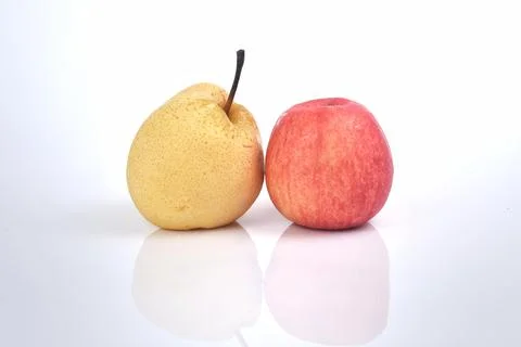An image of red apple and pear isolated on a white background. Food concept Stock Photos