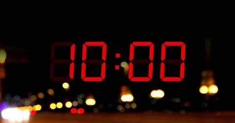 Image of red digital timer changing with traffic lights on black background Stock Illustration