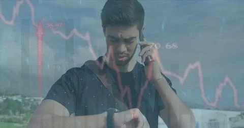 Image of red line financial data processing over biracial man on smartphone Stock Photos